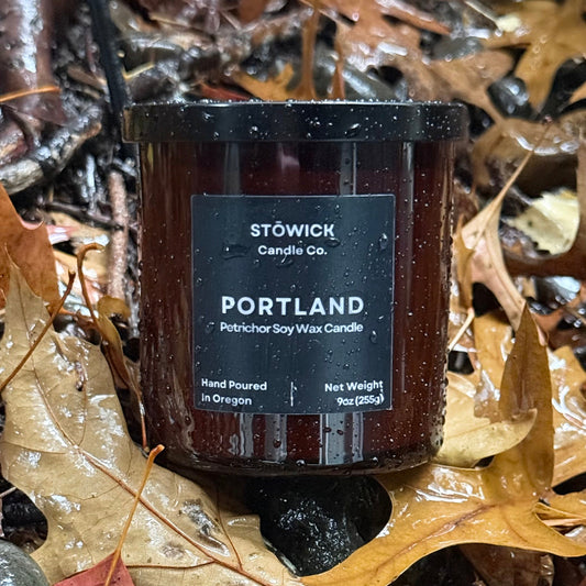 Stowick Candle Co. Portland tumbler candle on wet leaves