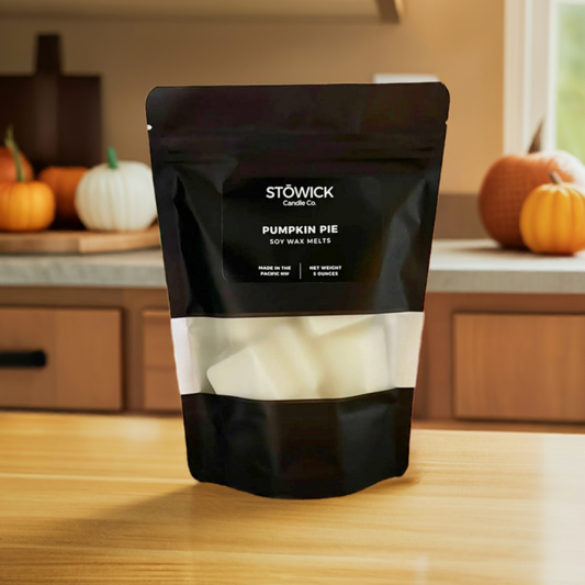a 5 ounce black bag of pure soy wax melts sitting on a table with pumpkin pie scent