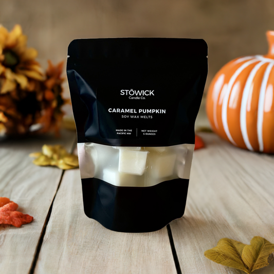 a 5 ounce bag of caramel pumpkin soy wax melts on a table by fall decor