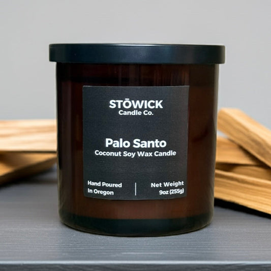 Stowick Candle Co. Palo Santo tumbler candle with a black label on a gray background