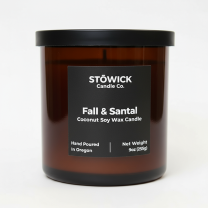 Fall and Santal tumbler candle by Stowick candles in an amber jar with a white background 