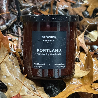 Stowick Candles Portland tumbler candle on wet leaves