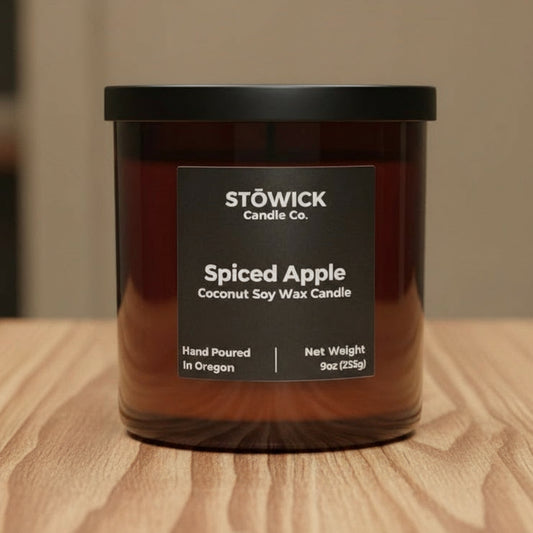 Stowick Candle Co. Spiced Apple candle on a wooden surface