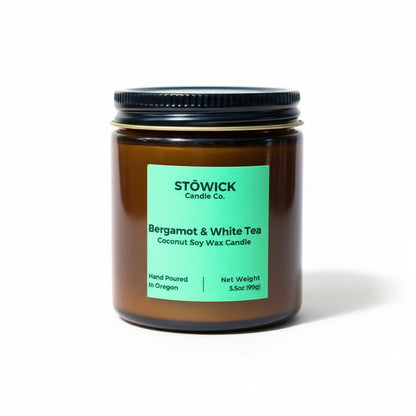 Stowick bergamot and white tea mini candle with a green label on a white background