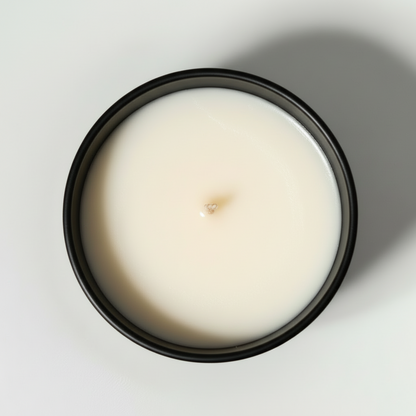 a birds eye view of a city of roses candle in a black jar with a white background 