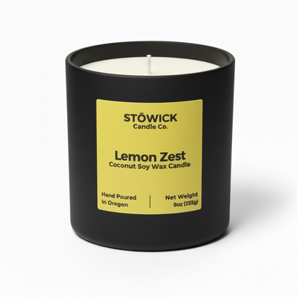 Stowick Candle Co. Lemon Zest tumbler candle with a black container and yellow label on a white background