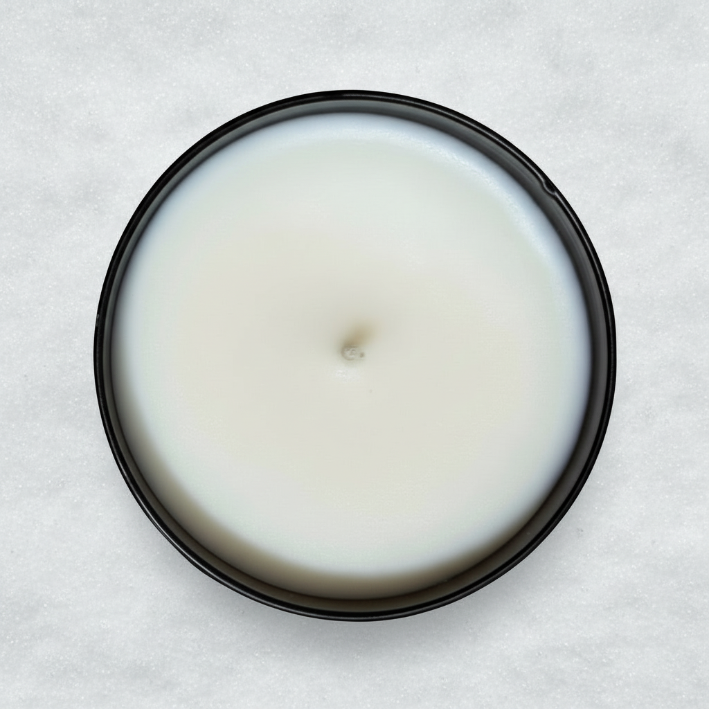 Mt hood tumbler candle in a black container in the snow