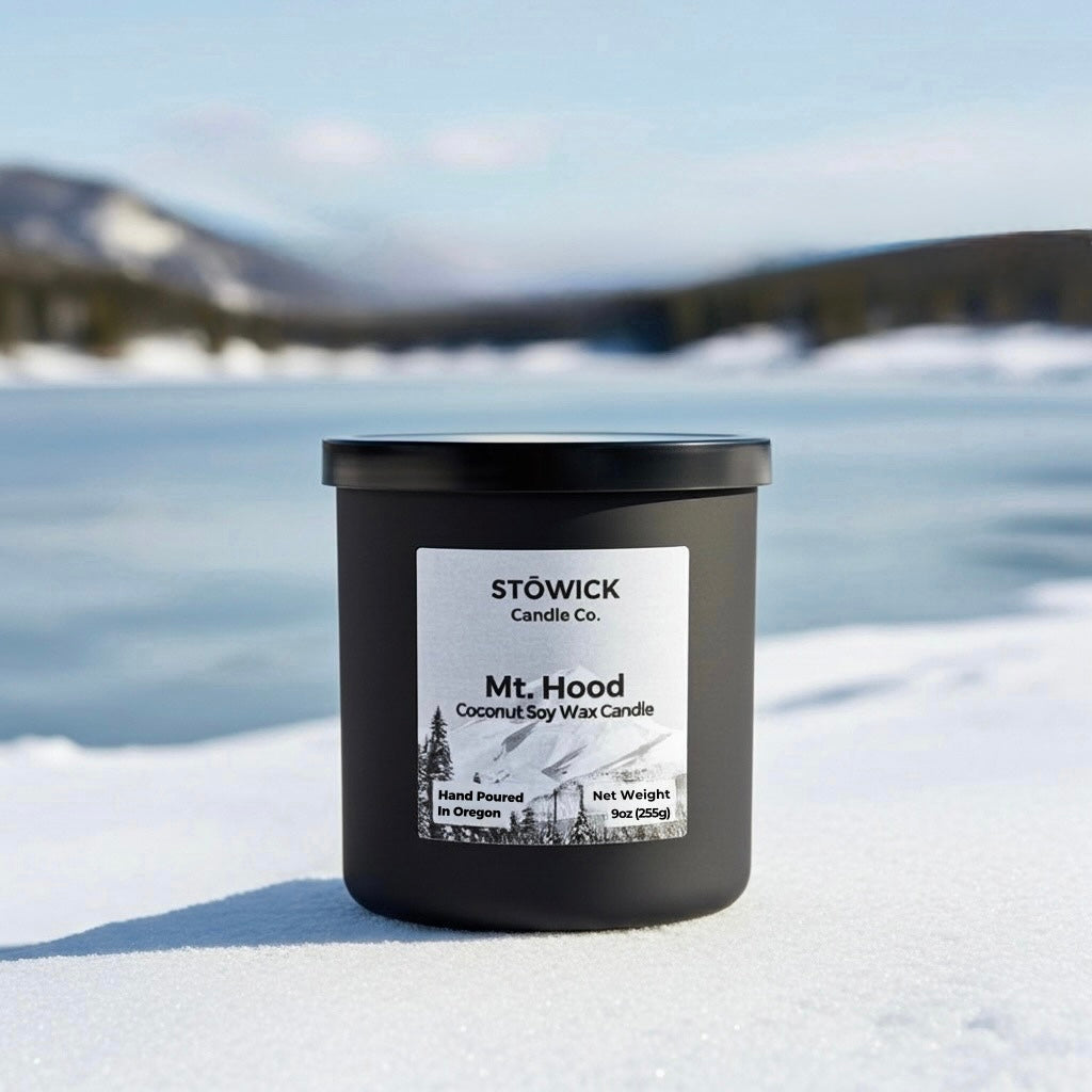 My hood tumbler candle with a snowy landscape in the background 
