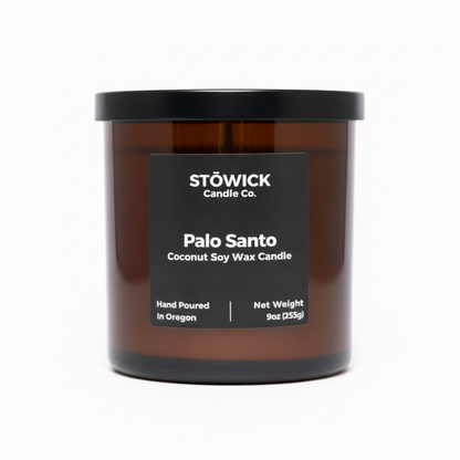Stöwick Candle Co. Palo Santo candle in amber jar with black lid on a white background