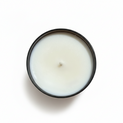 birds eye view of a pumpkin cold foam tumbler candle with a white background 