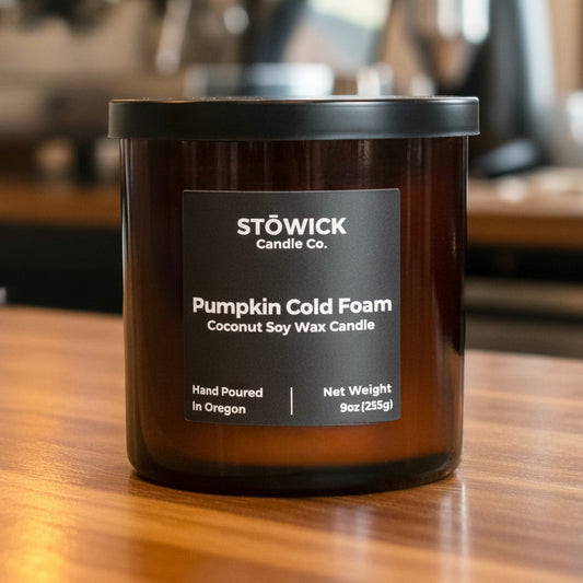 Stowick Candle Co. Pumpkin Cold Foam tumbler candle on a wooden surface