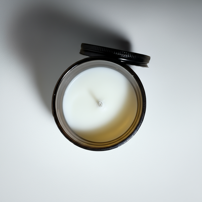 a view from above of a pumpkin spice mini candle on a white table