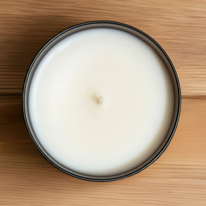 Pumpkin spice tumbler candle sitting on a wood table