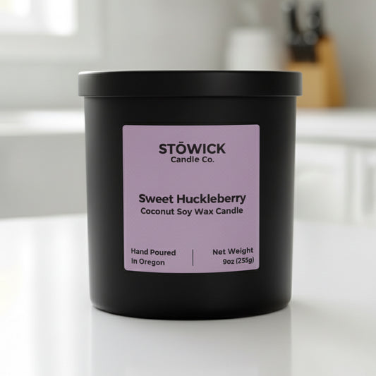 Stowick Candle Co. Sweet Huckleberry candle on a white surface